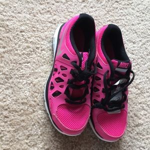 Pink Nike running shoes